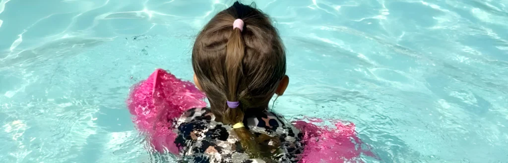 A child swimming in a pool